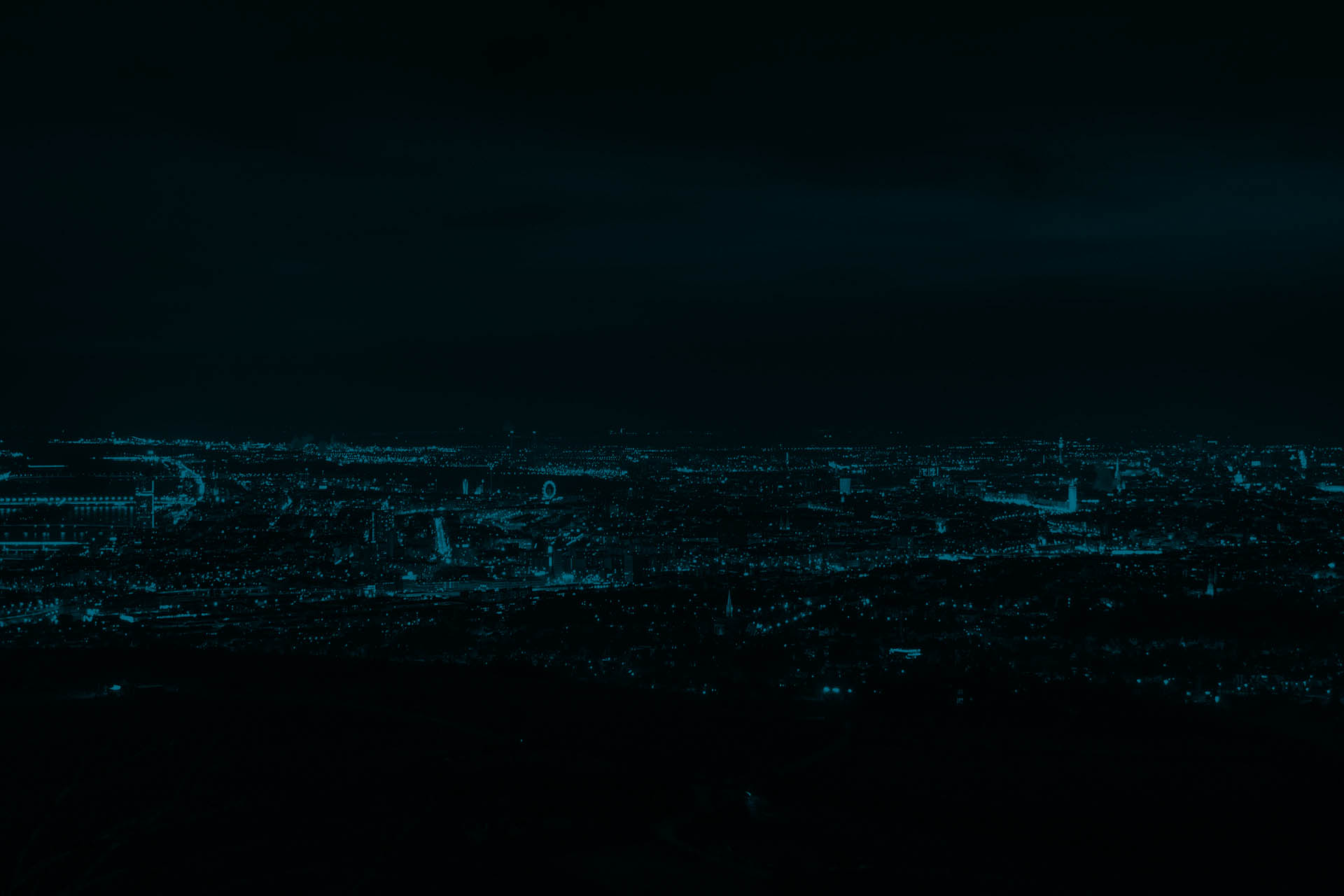 Aerial view of Vienna in the night with a lot of lights from buildings shining.